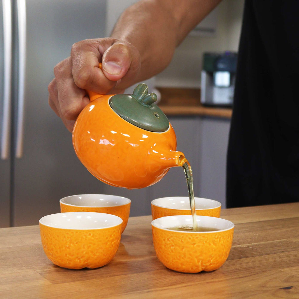 Herbal Orange Teapot Set with Four Matching Cups for Tea Lovers