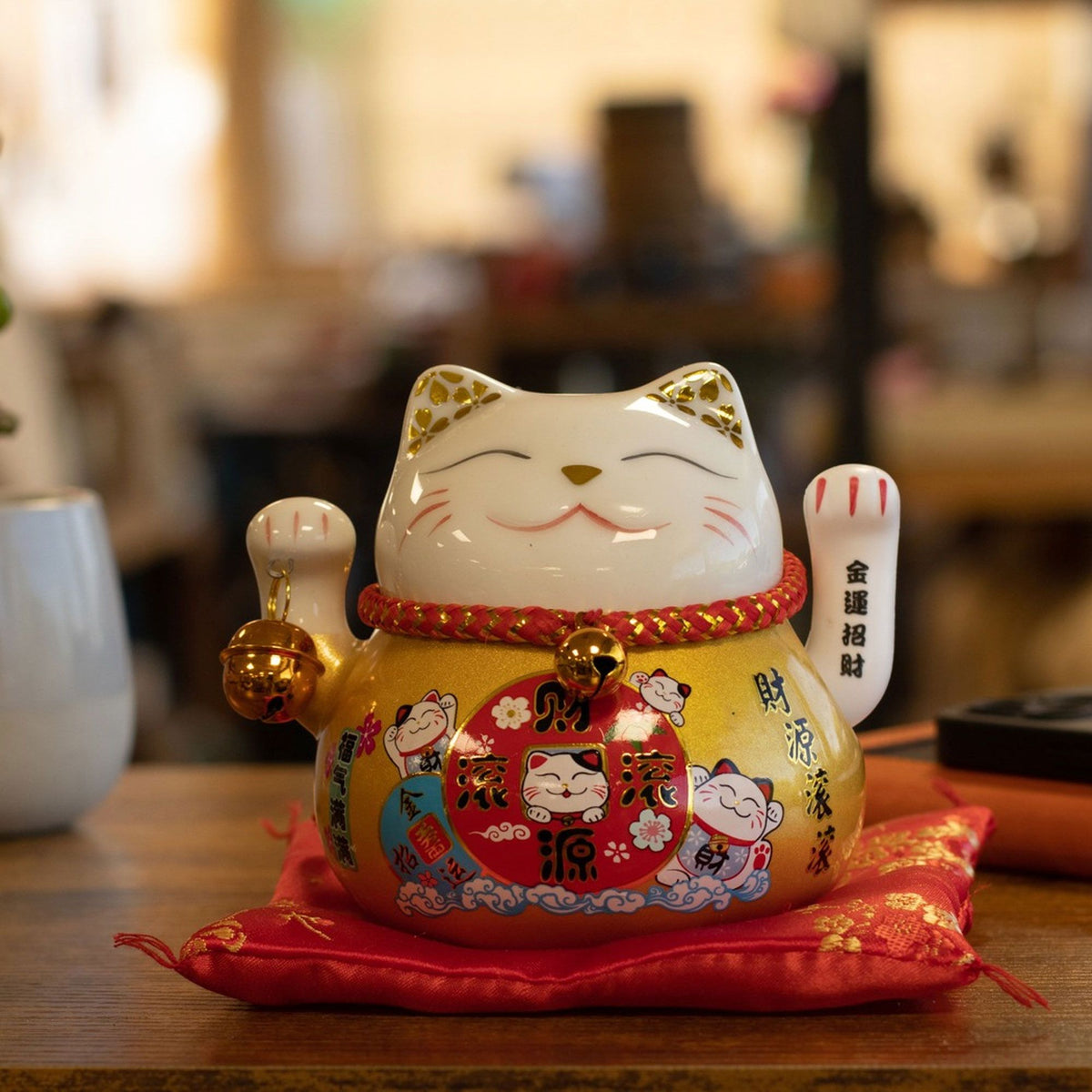 Japanese Lucky Cat Ceramic Waving Ornament on Cushion – Gold
