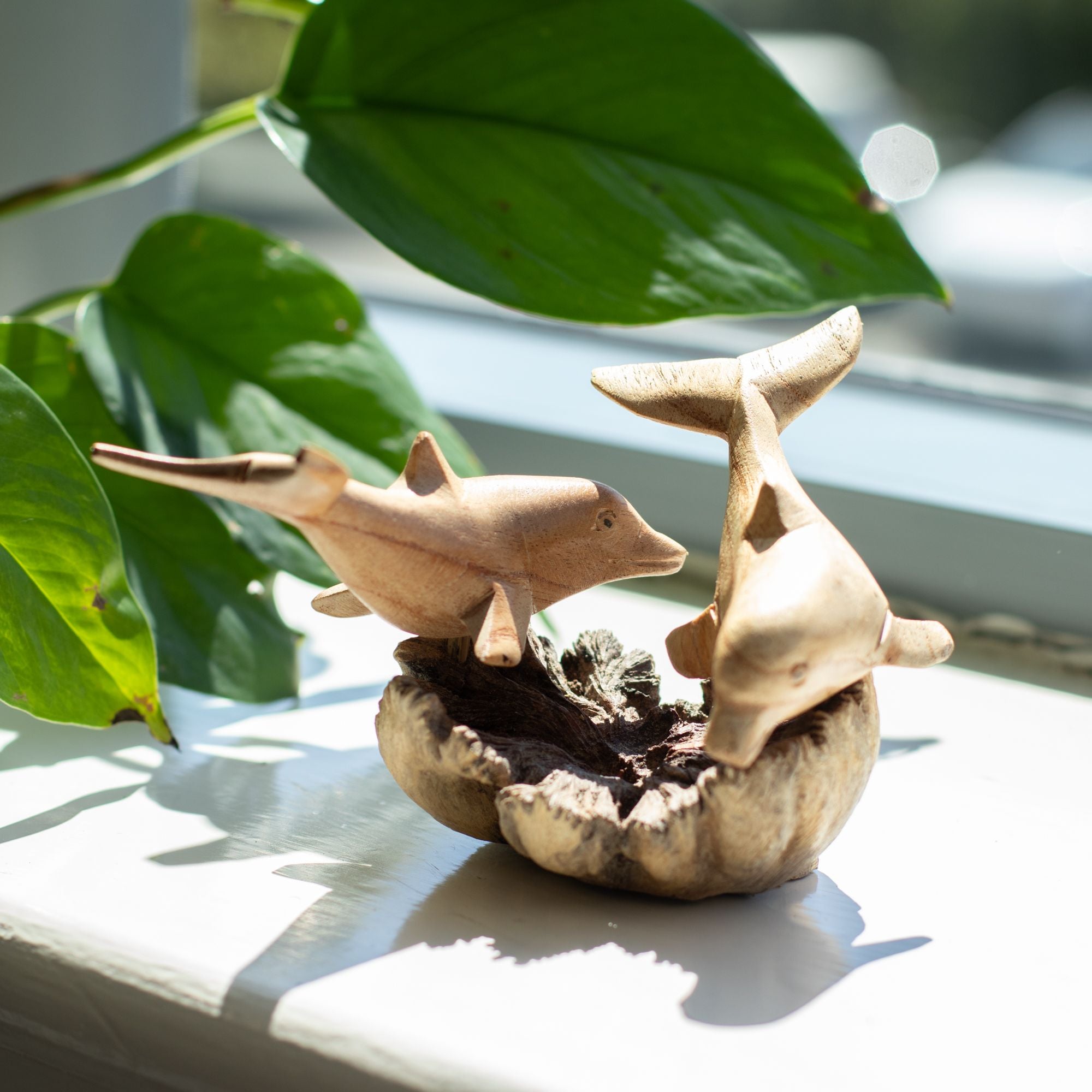 Handmade Parasite Wood Art Carving of Playful Dolphins in Motion