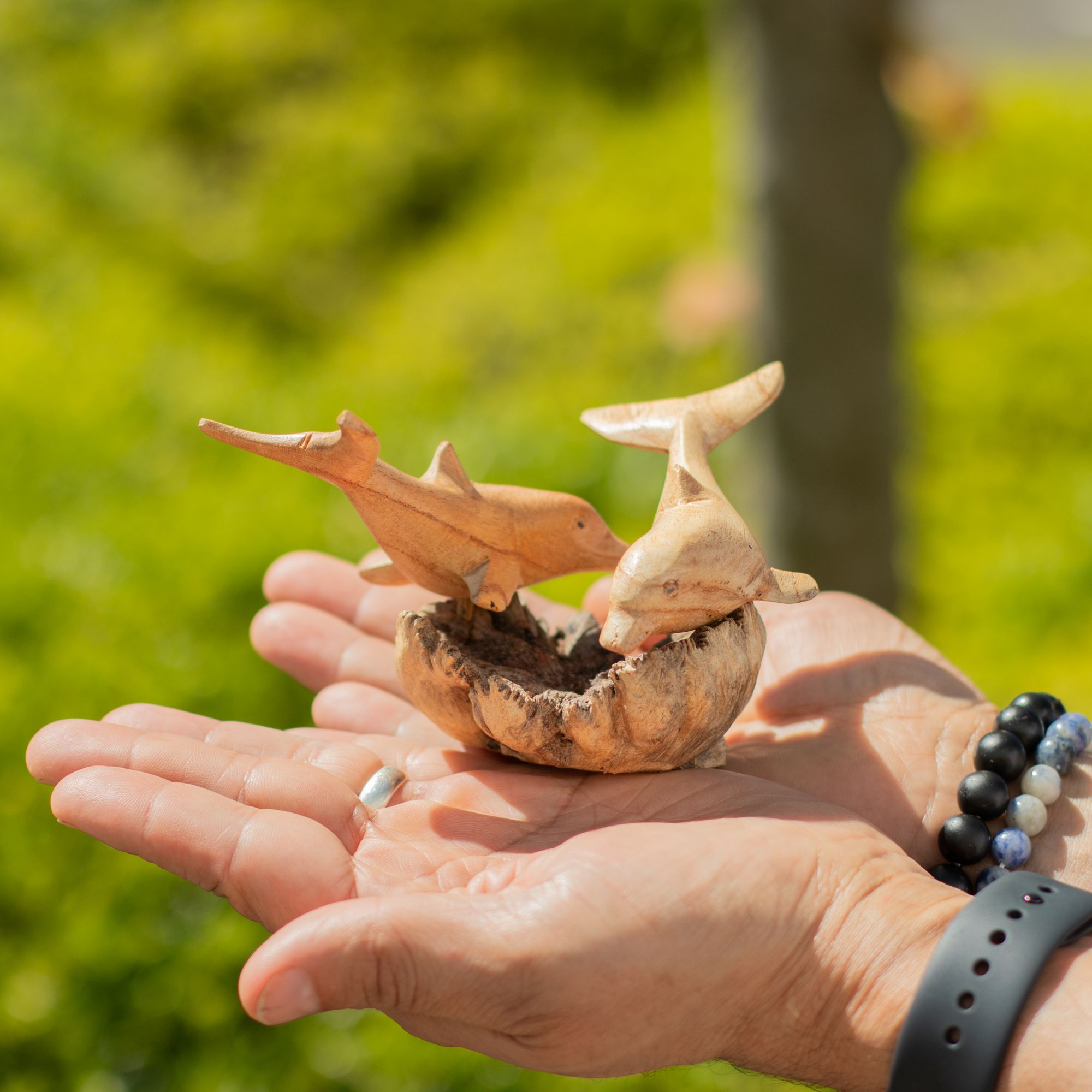 Handmade Parasite Wood Art Carving of Playful Dolphins in Motion