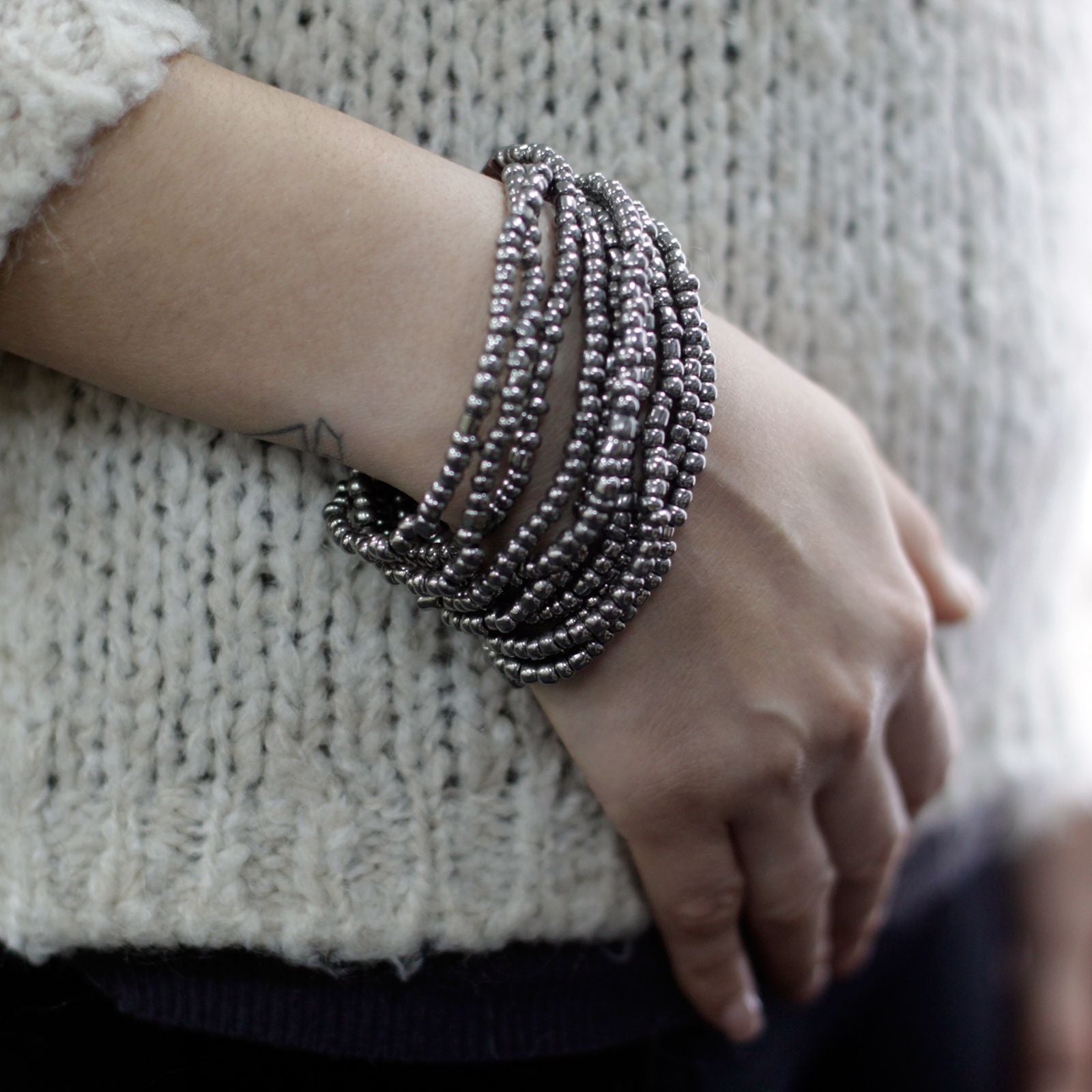 Multi Bead Bangle with Wooden Clasp in Assorted Gold and Bronze