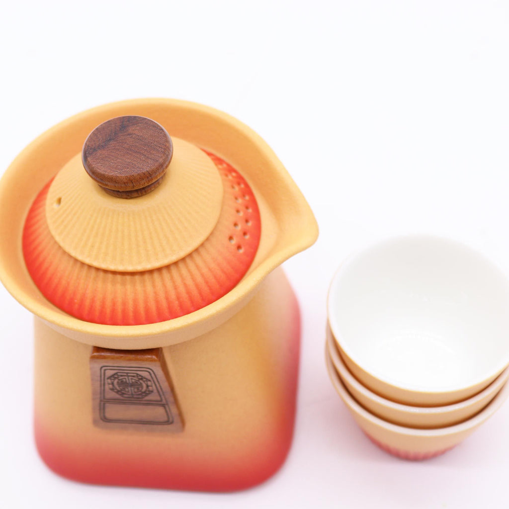 Temple Teapot Set with Three Cups in Vibrant Orange Earth Tones