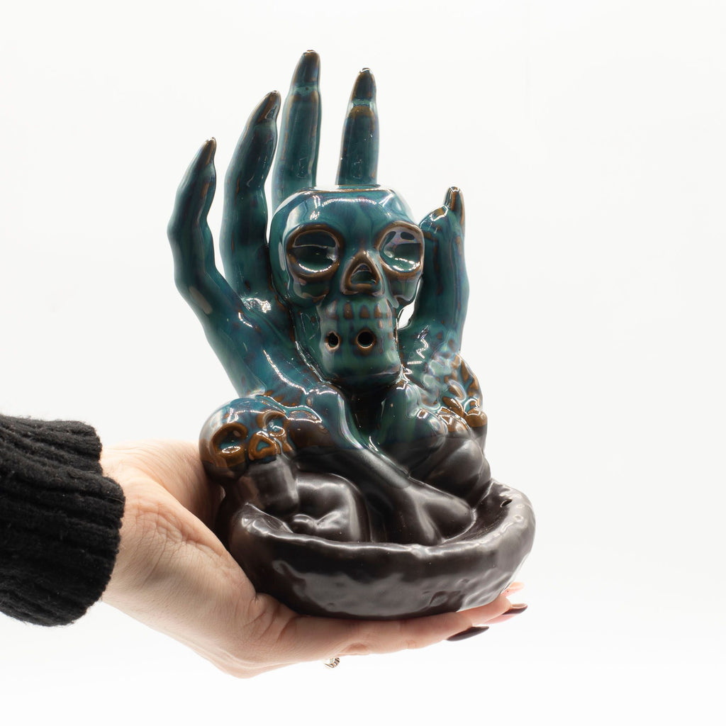 Skull in Hand Backflow Incense Burner for Dramatic Home Décor
