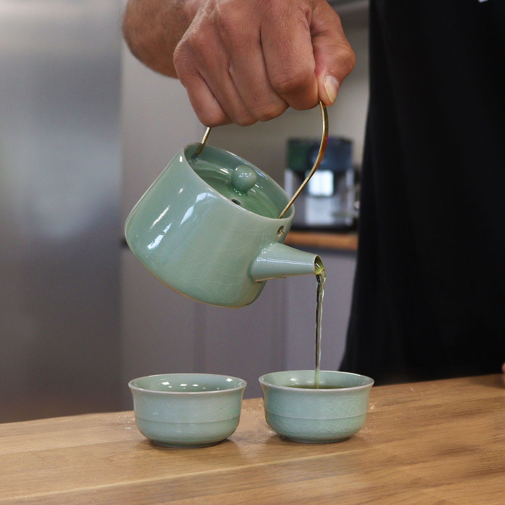 Herbal Jade Teapot Set with Elegant Design and Two Cups